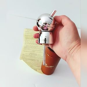 Jigger measure for alcoholic drink.